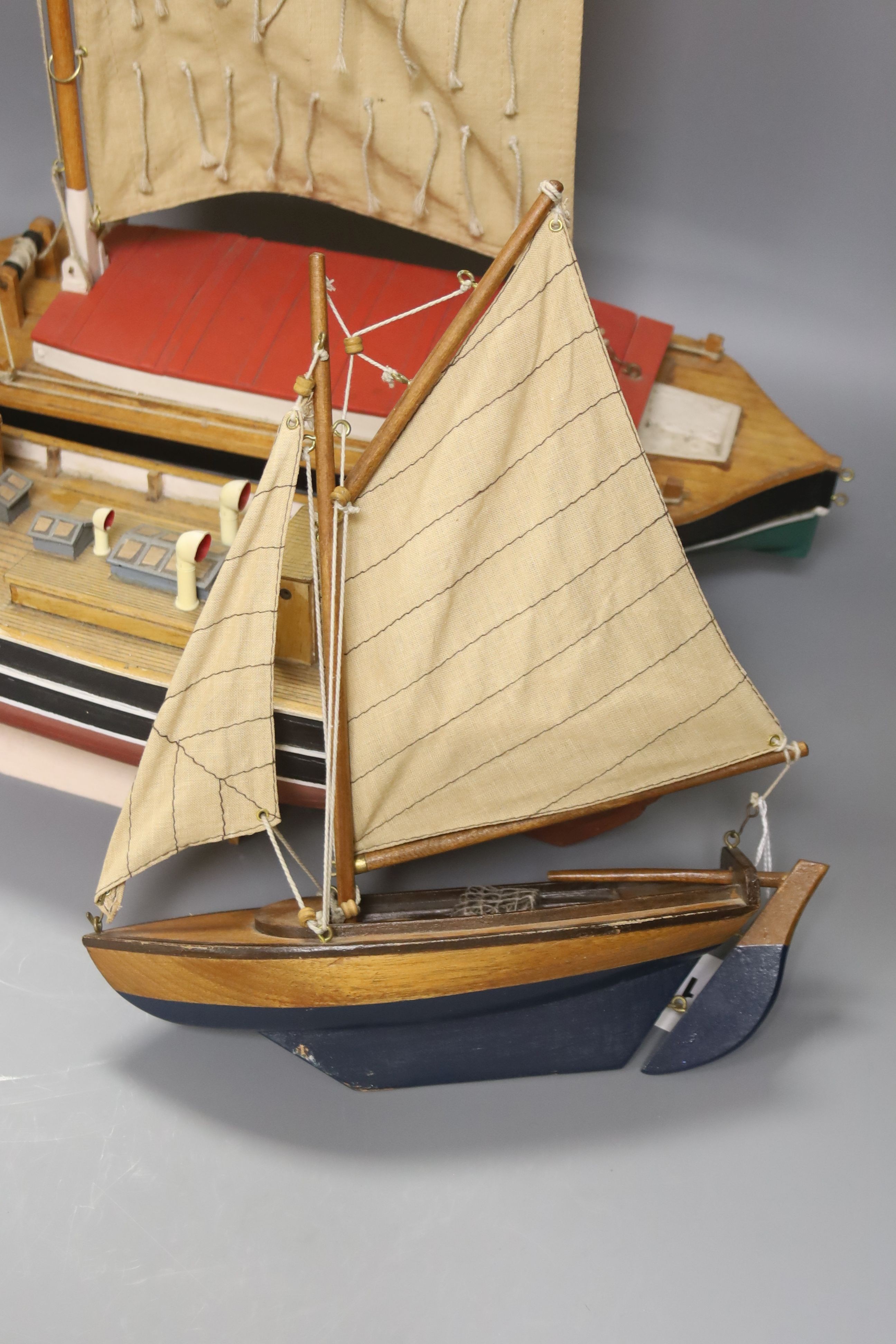 Two pond yachts and a model of a ship, longest 51.5 cm